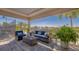 Covered patio with comfortable seating, a coffee table, a rug, and a view of the water at 6501 Stone River Rd # 304, Bradenton, FL 34203