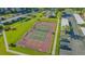 This aerial view highlights the community's outdoor tennis court at 6501 Stone River Rd # 304, Bradenton, FL 34203