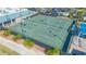 Aerial view of the community tennis courts surrounded by lush landscaping and convenient parking at 6501 Stone River Rd # 304, Bradenton, FL 34203