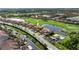 Beautiful aerial view of community homes, golf course and lake at 6618 Grand Estuary Trl # 101, Bradenton, FL 34212