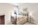 This bedroom features a full-sized bed and matching end tables at 6618 Grand Estuary Trl # 101, Bradenton, FL 34212