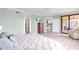Comfortable bedroom with access to a screened-in porch, neutral color palette, and cozy furnishings at 6618 Grand Estuary Trl # 101, Bradenton, FL 34212