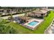 Beautiful community pool with a covered gazebo and plenty of chairs for lounging at 6618 Grand Estuary Trl # 101, Bradenton, FL 34212