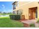 Inviting exterior view of the home featuring a well-manicured lawn and an attractive entryway at 6618 Grand Estuary Trl # 101, Bradenton, FL 34212
