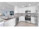 Modern kitchen features stainless steel appliances, granite countertops, and ample cabinet space at 6618 Grand Estuary Trl # 101, Bradenton, FL 34212
