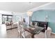 Open living area featuring a glass table, seating area, and view to the outdoors at 6618 Grand Estuary Trl # 101, Bradenton, FL 34212