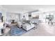 Bright living room showcases an open layout connecting the kitchen, dining, and living spaces at 6618 Grand Estuary Trl # 101, Bradenton, FL 34212