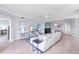 Spacious living room featuring tile floors, neutral colors and ample natural light at 6618 Grand Estuary Trl # 101, Bradenton, FL 34212
