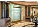 The building lobby features a decorative waterfall feature with decorative pillars at 6618 Grand Estuary Trl # 101, Bradenton, FL 34212