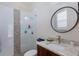 Bathroom features modern fixtures, a tiled shower, and a stylish vanity with countertop at 7031 Scrub Jay Dr, Sarasota, FL 34241