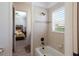 Bright bathroom with a tub shower, tiled walls, and natural light at 7031 Scrub Jay Dr, Sarasota, FL 34241