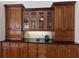 Elegant kitchen cabinetry with glass-front doors, providing ample storage space and stylish display at 7031 Scrub Jay Dr, Sarasota, FL 34241