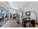 Comfortable living room with tile flooring, built-in shelving, and sliding doors to the outdoor space at 7031 Scrub Jay Dr, Sarasota, FL 34241