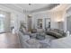 Elegant living room featuring stylish furnishings, neutral tones, and an abundance of natural light at 7031 Scrub Jay Dr, Sarasota, FL 34241