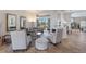 Bright and airy living room with stylish furnishings, a modern fireplace, and seamless access to outdoor living spaces at 7031 Scrub Jay Dr, Sarasota, FL 34241