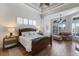Well-lit main bedroom with wood floors, a seating area and bright light at 7031 Scrub Jay Dr, Sarasota, FL 34241
