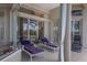 Relaxing patio with tile floors, outdoor seating, and access to the pool area at 7031 Scrub Jay Dr, Sarasota, FL 34241