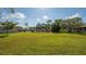 Lush backyard with expansive green lawn, ideal for relaxation or outdoor gatherings at 7142 Bright Creek Dr # 35, Sarasota, FL 34231