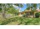 A partially shaded backyard features a wooden fence around the property at 7142 Bright Creek Dr # 35, Sarasota, FL 34231
