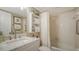 Bathroom featuring a single sink vanity, toilet and shower-tub combo with grab bar at 7142 Bright Creek Dr # 35, Sarasota, FL 34231