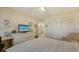Bedroom with a full dresser, closet, cozy chair and bright windows at 7142 Bright Creek Dr # 35, Sarasota, FL 34231