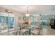 Inviting dining area adjacent to living room with natural lighting and neutral décor at 7142 Bright Creek Dr # 35, Sarasota, FL 34231