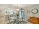 Bright dining space with a glass-top table, rug and comfortable chairs in a well-lit interior at 7142 Bright Creek Dr # 35, Sarasota, FL 34231