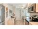 Bright kitchen with white cabinets, stainless appliances, breakfast table and a workstation at 7142 Bright Creek Dr # 35, Sarasota, FL 34231