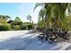 Community picnic area with tables, umbrellas, and palm trees at 7142 Bright Creek Dr # 35, Sarasota, FL 34231