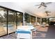 Bright indoor seating area perfect for poolside relaxation, with ceiling fans and scenic views at 7142 Bright Creek Dr # 35, Sarasota, FL 34231
