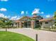Community center featuring a welcoming entrance, stone accents, and well-maintained grounds at 7229 Lake Forest Gln, Lakewood Ranch, FL 34202