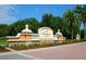 Elegant community entrance sign featuring lush landscaping and architectural details at 7229 Lake Forest Gln, Lakewood Ranch, FL 34202