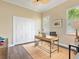 Bright home office featuring hardwood floors, plantation shutters, and a modern work space at 7229 Lake Forest Gln, Lakewood Ranch, FL 34202