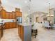 Spacious kitchen with central island, stainless steel appliances, and open dining area at 7229 Lake Forest Gln, Lakewood Ranch, FL 34202