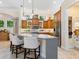 Stylish kitchen with a large center island, stainless appliances, and custom cabinets at 7229 Lake Forest Gln, Lakewood Ranch, FL 34202