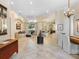 Spacious living room featuring tile floors, elegant decor, and an abundance of natural light at 7229 Lake Forest Gln, Lakewood Ranch, FL 34202