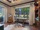Bright office features a large window offering stunning views and a unique cowhide rug at 7229 Lake Forest Gln, Lakewood Ranch, FL 34202