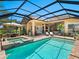 Gorgeous pool, patio, and screened lanai with an outdoor kitchen at 7229 Lake Forest Gln, Lakewood Ranch, FL 34202