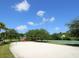 Community recreation area featuring a volleyball court, playground, and basketball court at 7229 Lake Forest Gln, Lakewood Ranch, FL 34202
