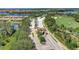 Aerial view of a gated community entrance surrounded by lush landscaping, lakes, and manicured grounds at 7705 Grand Estuary Trl # 206, Bradenton, FL 34212