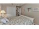Bedroom featuring a seashell themed bed, a closet and beach themed wall art at 7705 Grand Estuary Trl # 206, Bradenton, FL 34212