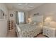 Well-lit bedroom with a decorative seashell themed bed, window and a ceiling fan at 7705 Grand Estuary Trl # 206, Bradenton, FL 34212