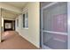 Condo hallway with neutral walls and flooring, showcasing a clean and welcoming entrance at 7705 Grand Estuary Trl # 206, Bradenton, FL 34212