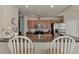 Well-equipped kitchen featuring stainless steel appliances, granite countertops, and wooden cabinetry at 7705 Grand Estuary Trl # 206, Bradenton, FL 34212