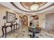The clubhouse lobby features a high decorative ceiling and stylish furnishings at 7705 Grand Estuary Trl # 206, Bradenton, FL 34212