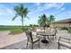A beautiful outdoor patio features comfortable seating and views of the lush community at 7705 Grand Estuary Trl # 206, Bradenton, FL 34212