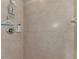 A tiled shower with a shower head, faucet, and shampoo bottles at 7705 Grand Estuary Trl # 206, Bradenton, FL 34212