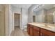 Updated bathroom with a shower, sink with wood cabinets, and plenty of storage at 7983 Limestone Ln # 14-201, Sarasota, FL 34233