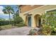 Charming home featuring a landscaped front entrance with a brick walkway and inviting doorway at 7983 Limestone Ln # 14-201, Sarasota, FL 34233