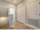 Hallway with wood-look floors near closets and bathroom at 7983 Limestone Ln # 14-201, Sarasota, FL 34233